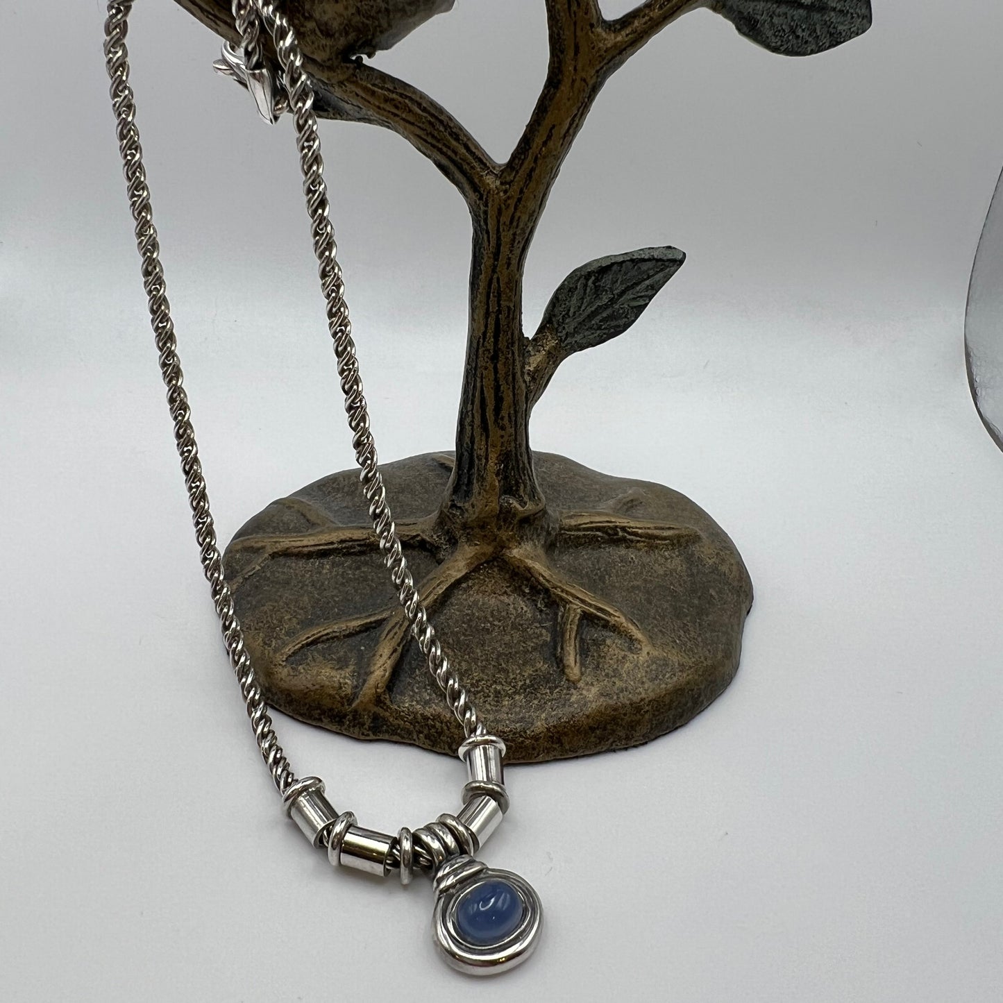 Vintage Sterling Silver Twisted Chain Necklace Featuring a Striking Light Blue Chalcedony Pendant.