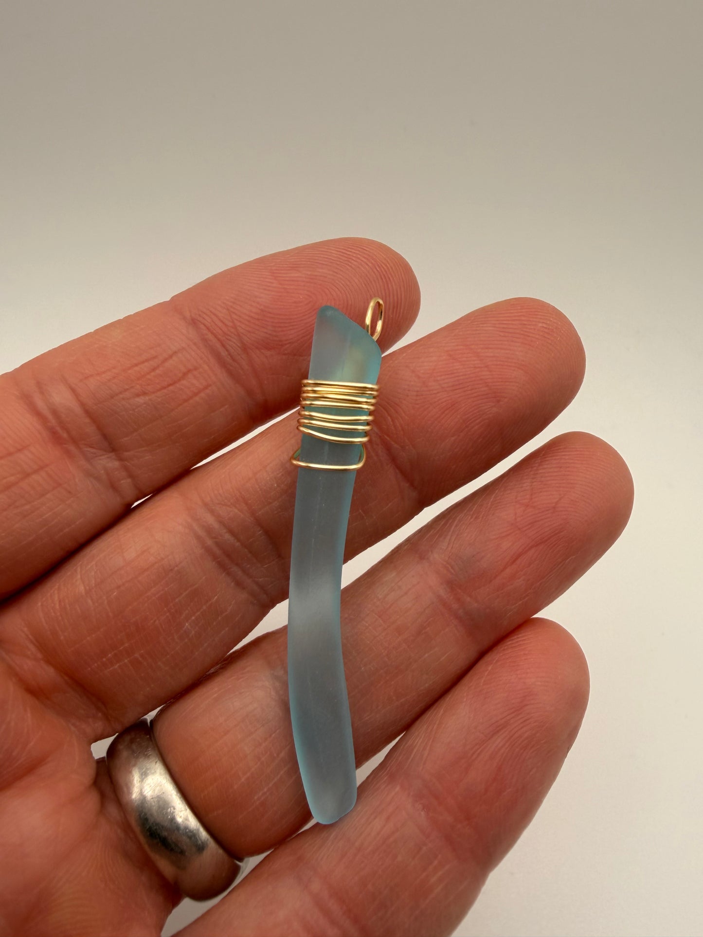 Light Blue Tumbled Glass Pendant with Gold Tone Wire