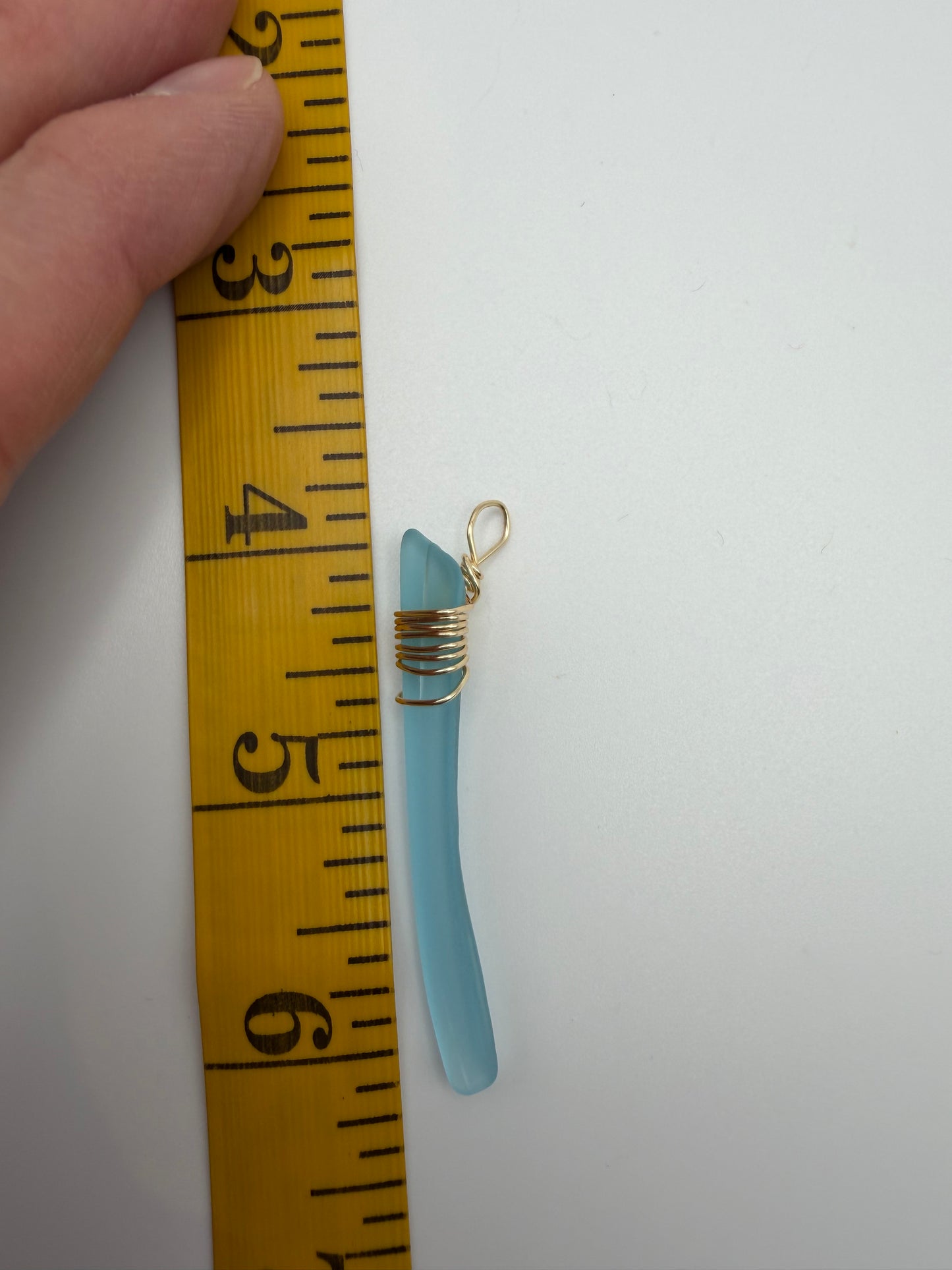 Light Blue Tumbled Glass Pendant with Gold Tone Wire