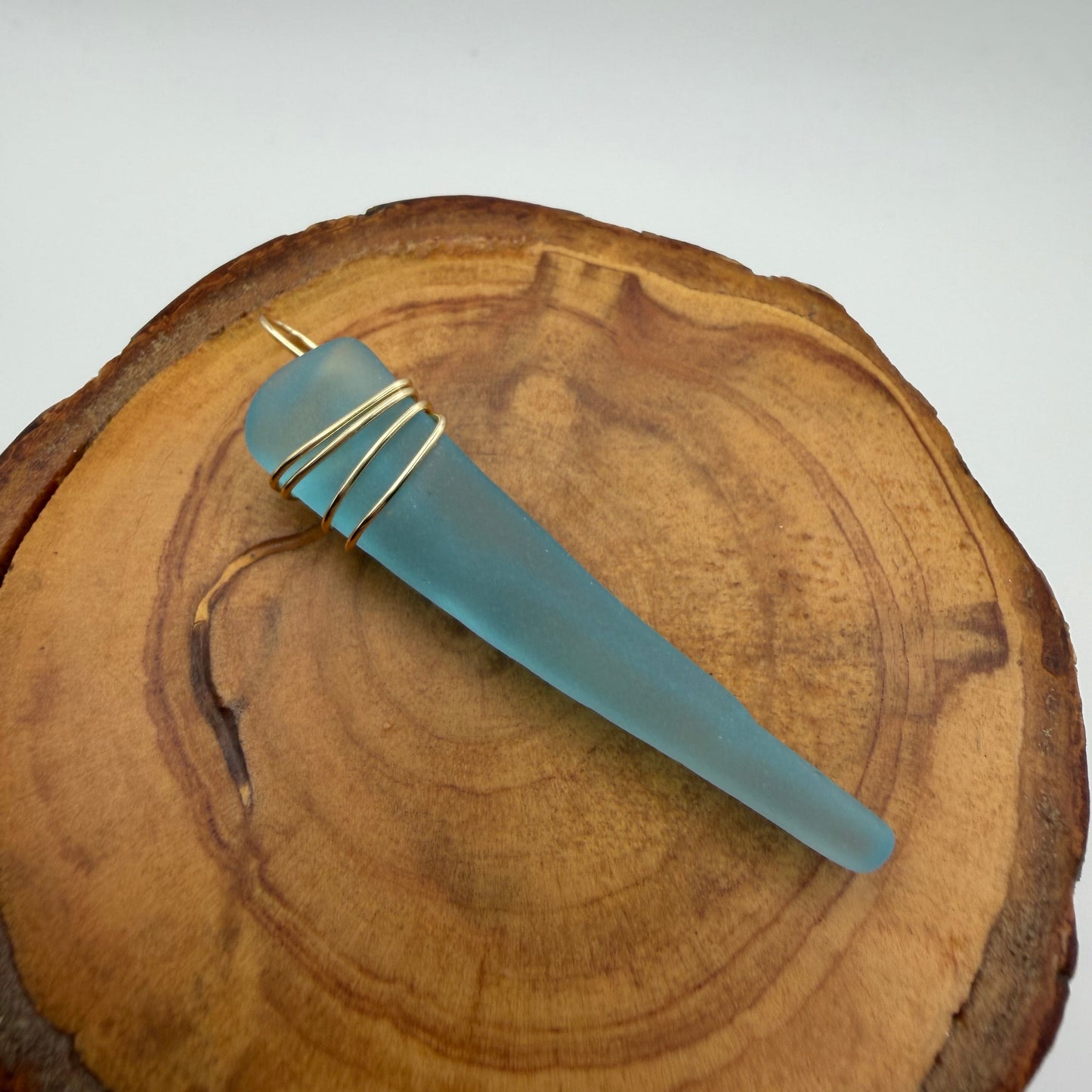 Hand Wrapped Blue Tumbled Glass Pendant with Gold Wire Wrap