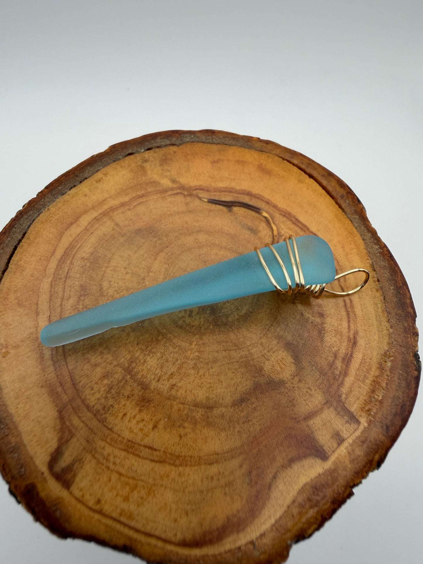 Hand Wrapped Blue Tumbled Glass Pendant with Gold Wire Wrap