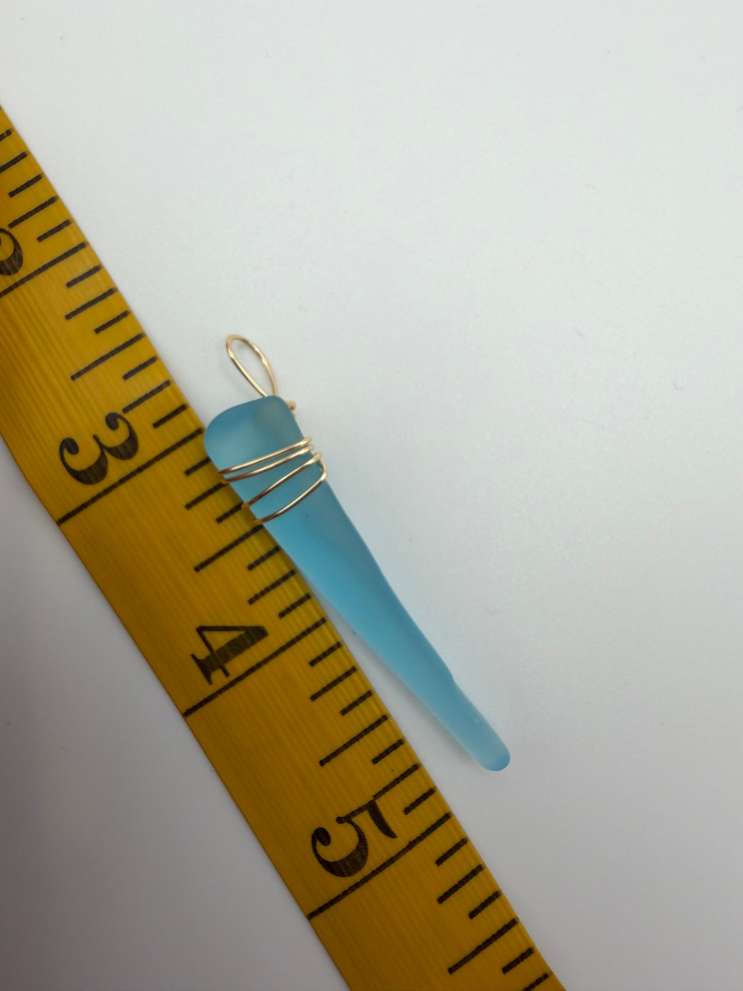 Hand Wrapped Blue Tumbled Glass Pendant with Gold Wire Wrap